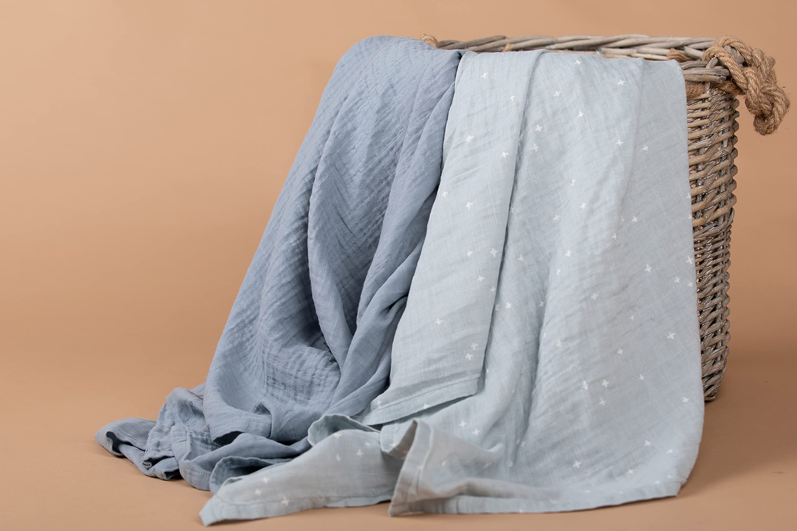 Sticky Toffee Muslin Swaddle doubles as changing pad cover during diaper changes.