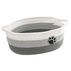 STOBS K small woven basket with handle keeps clutter organized on shelves.