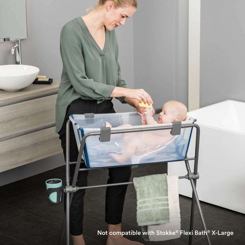 Stokke Flexi Bath Stand Grey draining hose keeps bath area tidy.