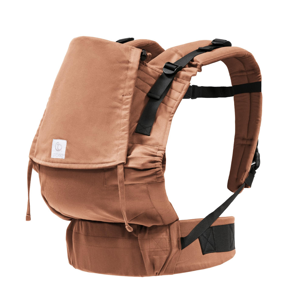 Stokke Limas Carrier Flex front view in terracotta showing ergonomic support.