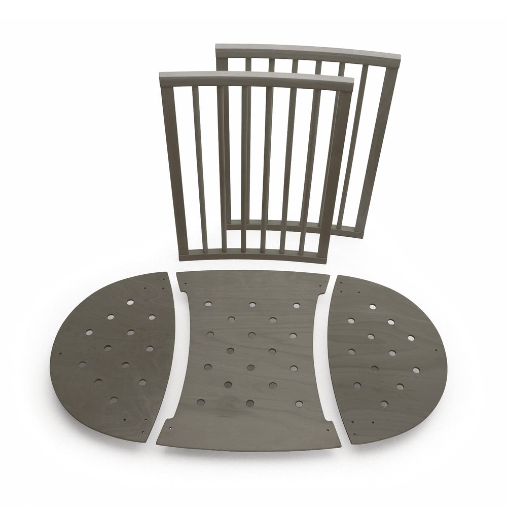 Stokke Sleepi Bed Extension V2 hazy grey packaging shows included parts for easy upgrade