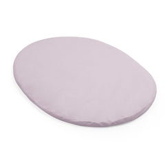 Stokke Sleepi Mini fitted sheet V3 Lavender on mattress offers soft cotton percale comfort for newborns.