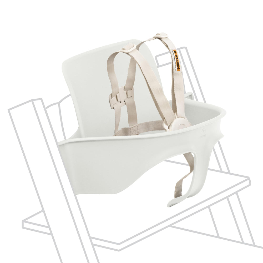 Stokke Tripp Trapp Baby Set 2 white attached to chair for stable high chair seating.