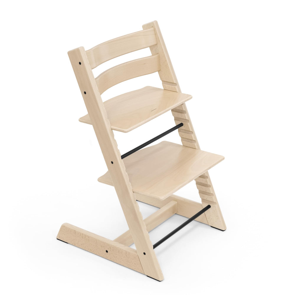 Stokke Tripp Trapp Chair natural wood finish supports growing kids with adjustable seating for family meals.