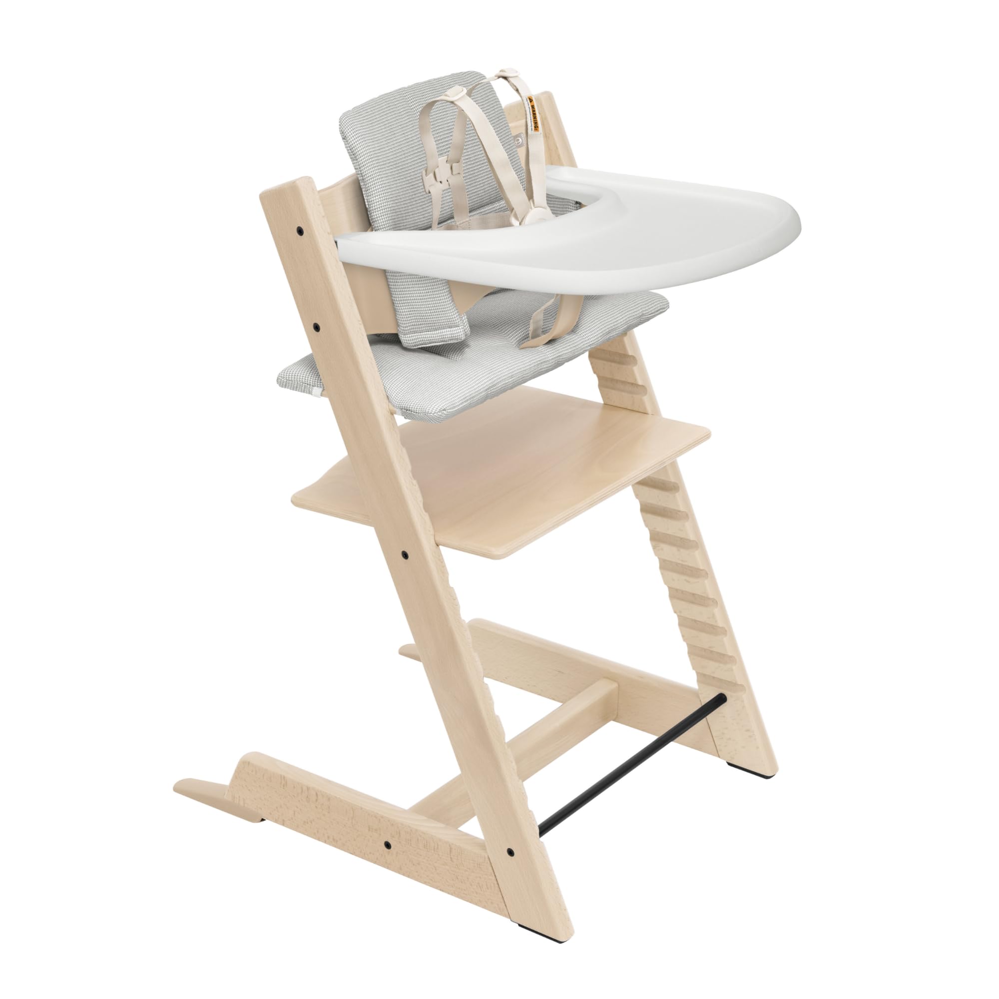 Stokke Tripp Trapp chair natural wood shows table-height seating for family meals.