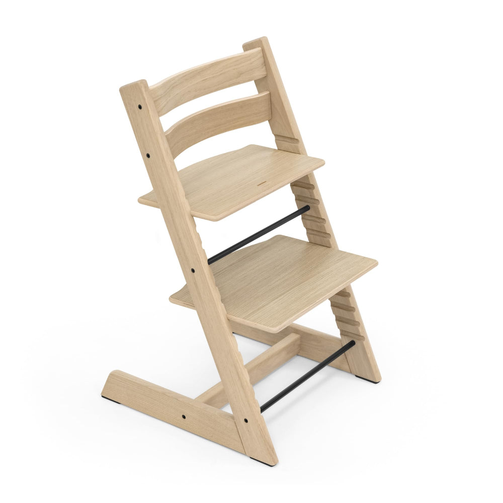 Stokke Tripp Trapp oak natural, forward view at table for inclusive family meals.