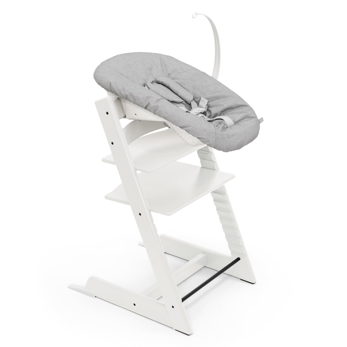 Stokke Tripp Trapp chair white side view shows growing-child usability for mealtime.