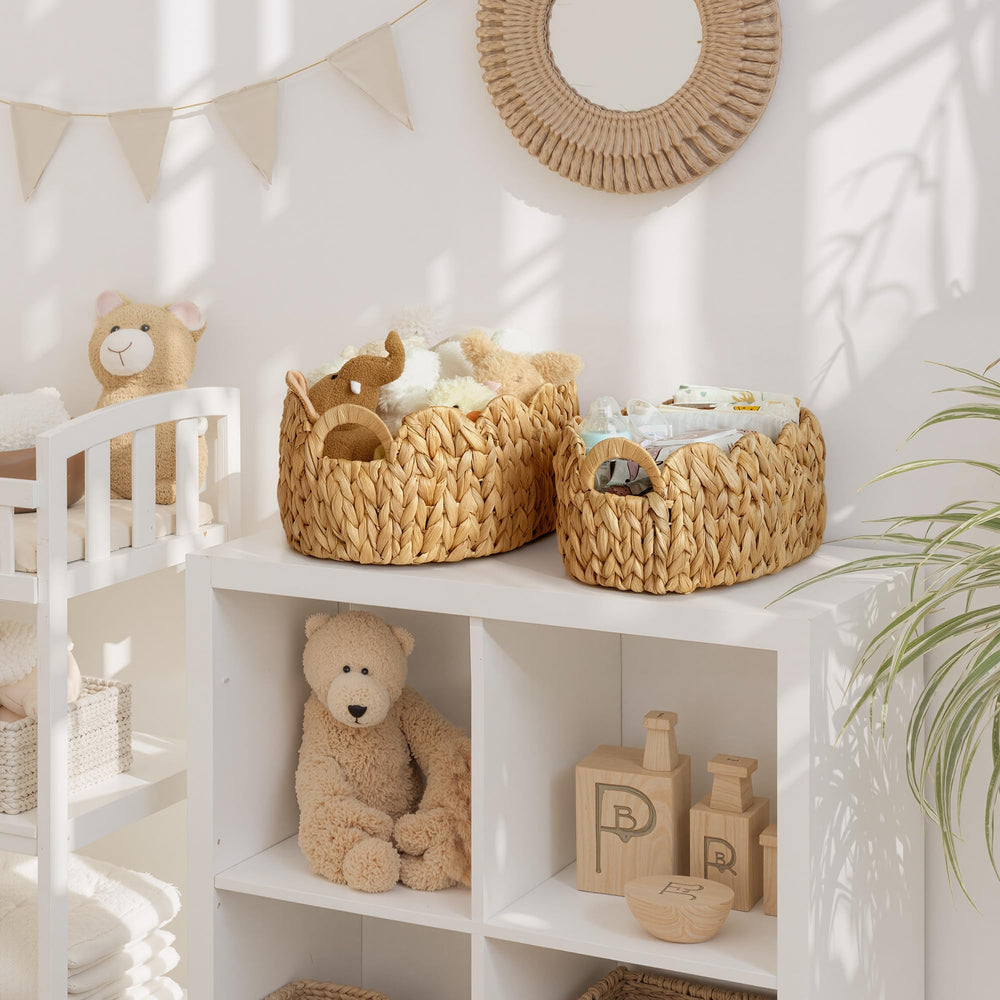 StorageWorks scalloped wicker basket built-in handles for easy relocation in the nursery.