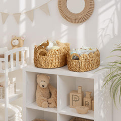 StorageWorks scalloped wicker basket built-in handles for easy relocation in the nursery.