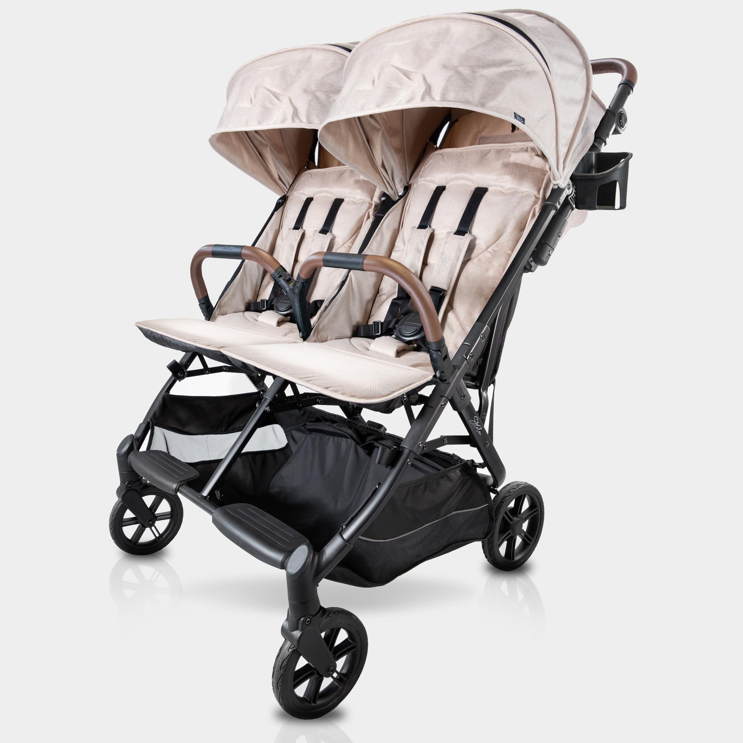 Strolee double stroller side-by-side fold demonstrating compact storage.