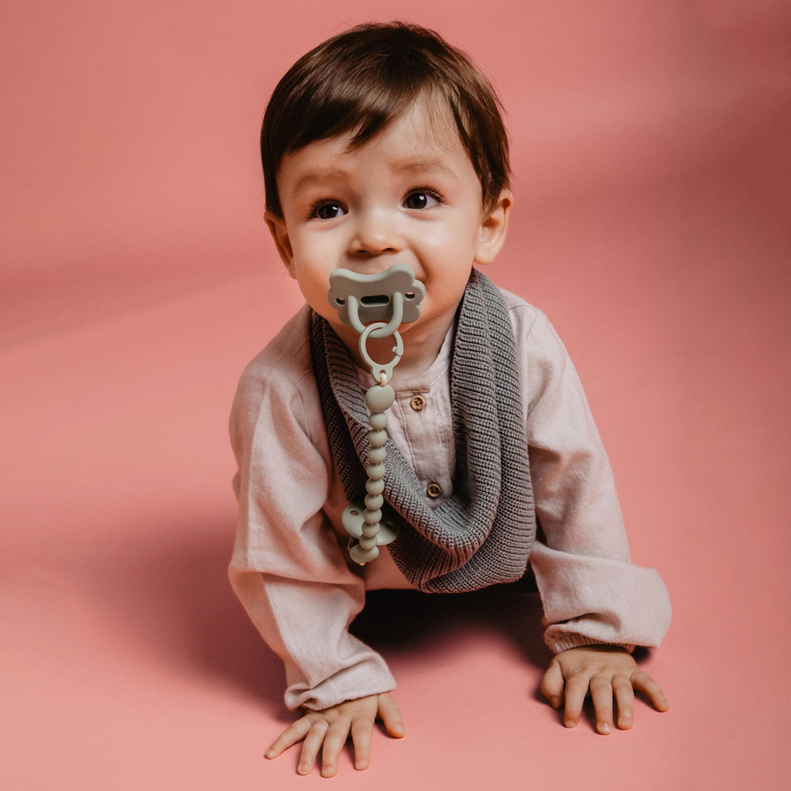 Suavinex Color Essence pacifier used during soothing routines for infants.