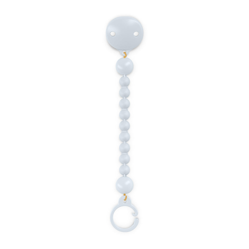 Suavinex Color Essence pacifier clip clips on clothes for easy access and cleanliness.