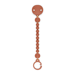 Suavinex Color Essence pacifier clip in sunset orange secures the pacifier for mess-free outings.