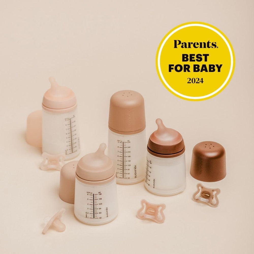 Suavinex Zero Zero bottle in-use with baby—supports breastfeeding-friendly feeding.