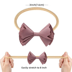 Subesty nylon elastic headband with soft flower for gentle newborn wear.