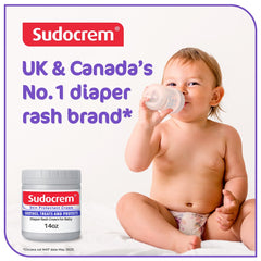 Sudocrem diaper rash cream being spread on baby skin for gentle protection.