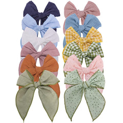Sugarmelon Fable Bow Avocado Blue assembly shot reveals soft linen fabric for gentle wear.