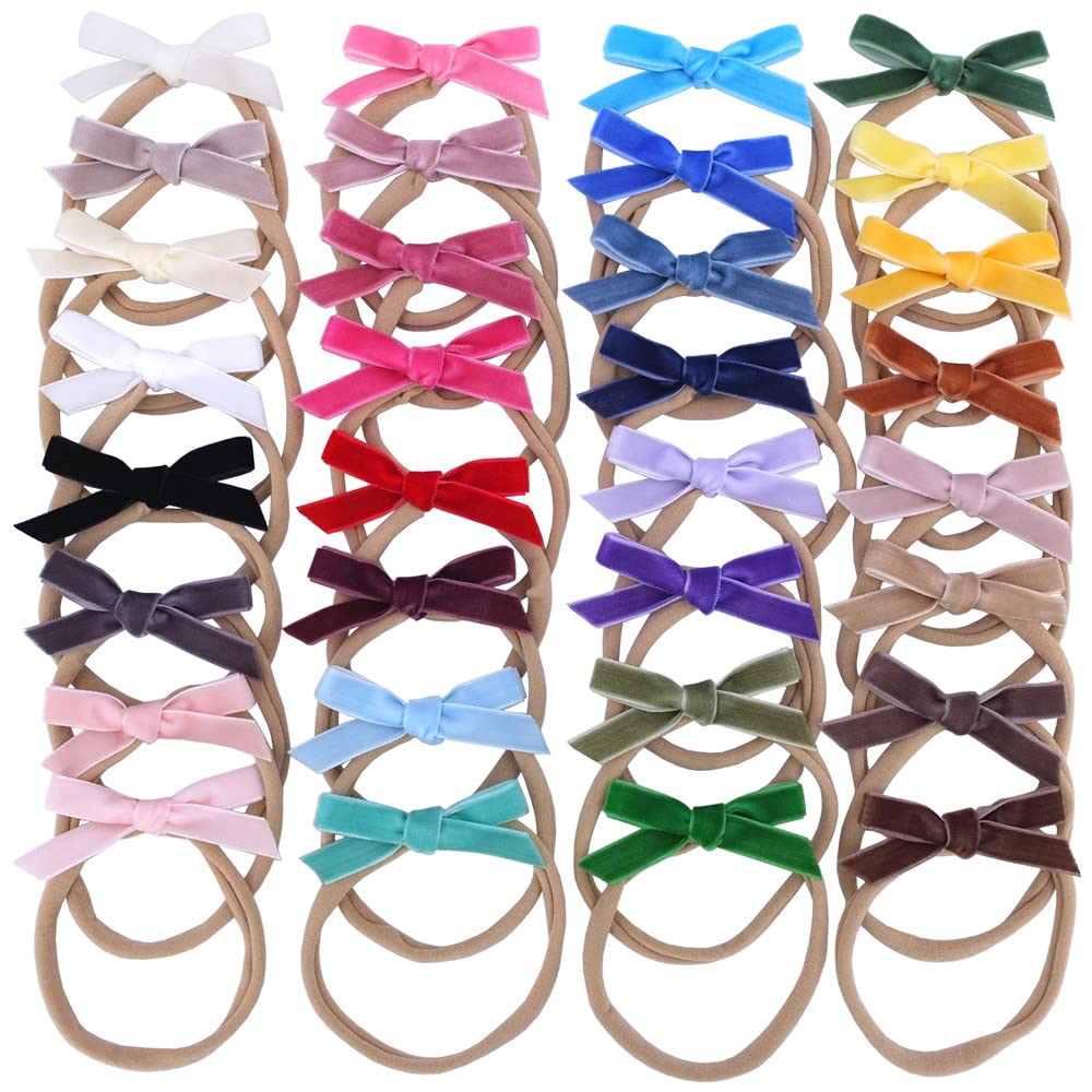 Sugarmelon velvet bow headband on newborn demonstrates soft nylon stretch for comfortable wear.