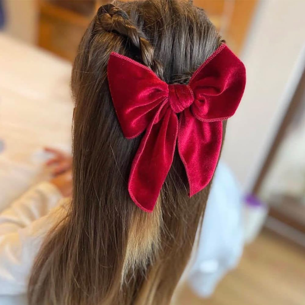 Sugarmelon Velvet Fable Bow clip in gold adds a luxe touch to family photos.