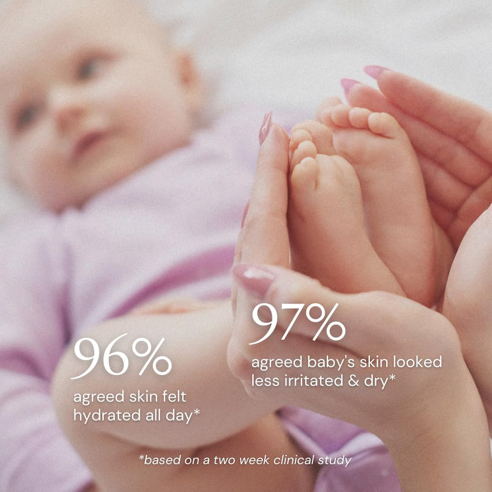 Sunborn Organics Baby Balm applied to baby's cheek for soothing moisture.
