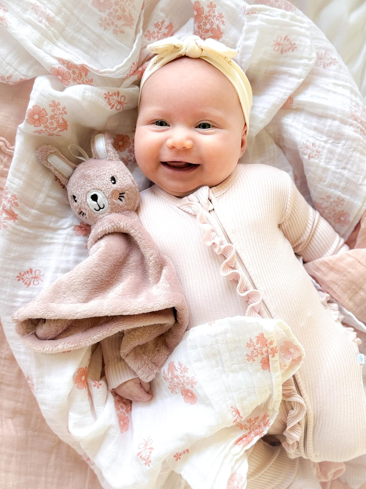 SUNSHINE & SNUGGLES Lovey pink bunny fabric closeup highlights ultra-soft texture for soothing cuddles.
