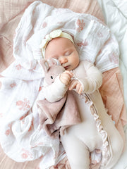 SUNSHINE & SNUGGLES Lovey pink bunny in hand shows portable, grab-and-go comfort.