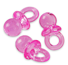 Super Z Outlet pink mini pacifiers used as playful cake toppers at celebrations.
