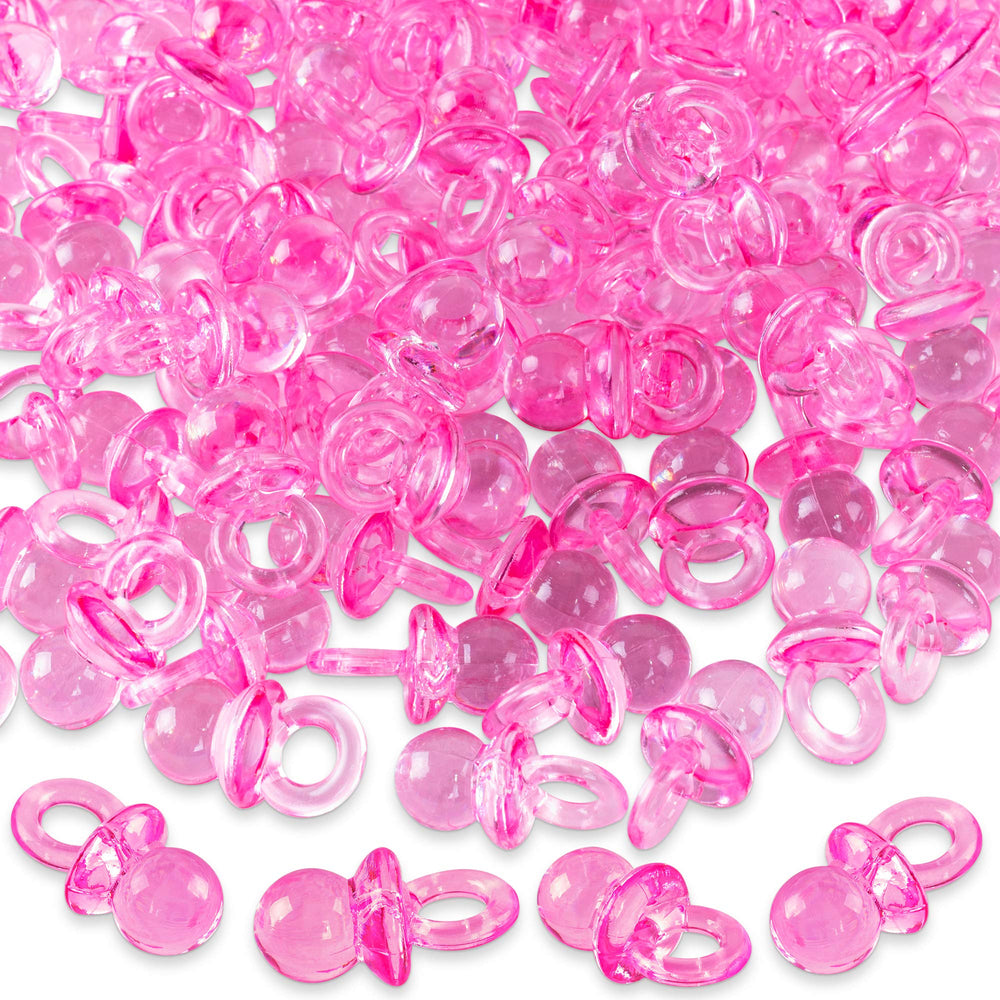 Super Z Outlet mini acrylic baby pacifiers pink pack shown as table scatter for baby shower decor.