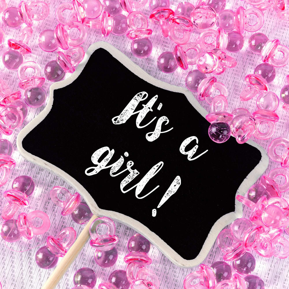 Super Z Outlet pink mini pacifiers arranged for DIY bracelets and necklaces.