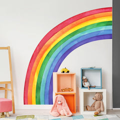 Supzone rainbow wall decals on a bedroom wall create a whimsical backdrop.