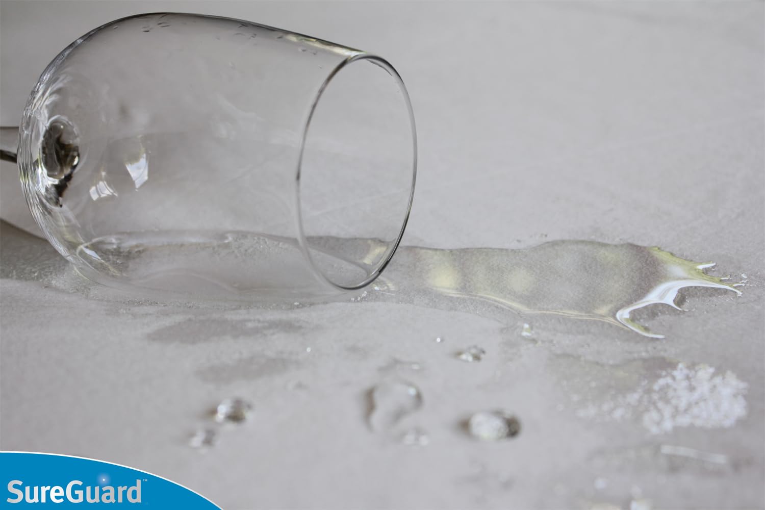 SureGuard protector close-up reveals waterproof layer and soft cotton surface.