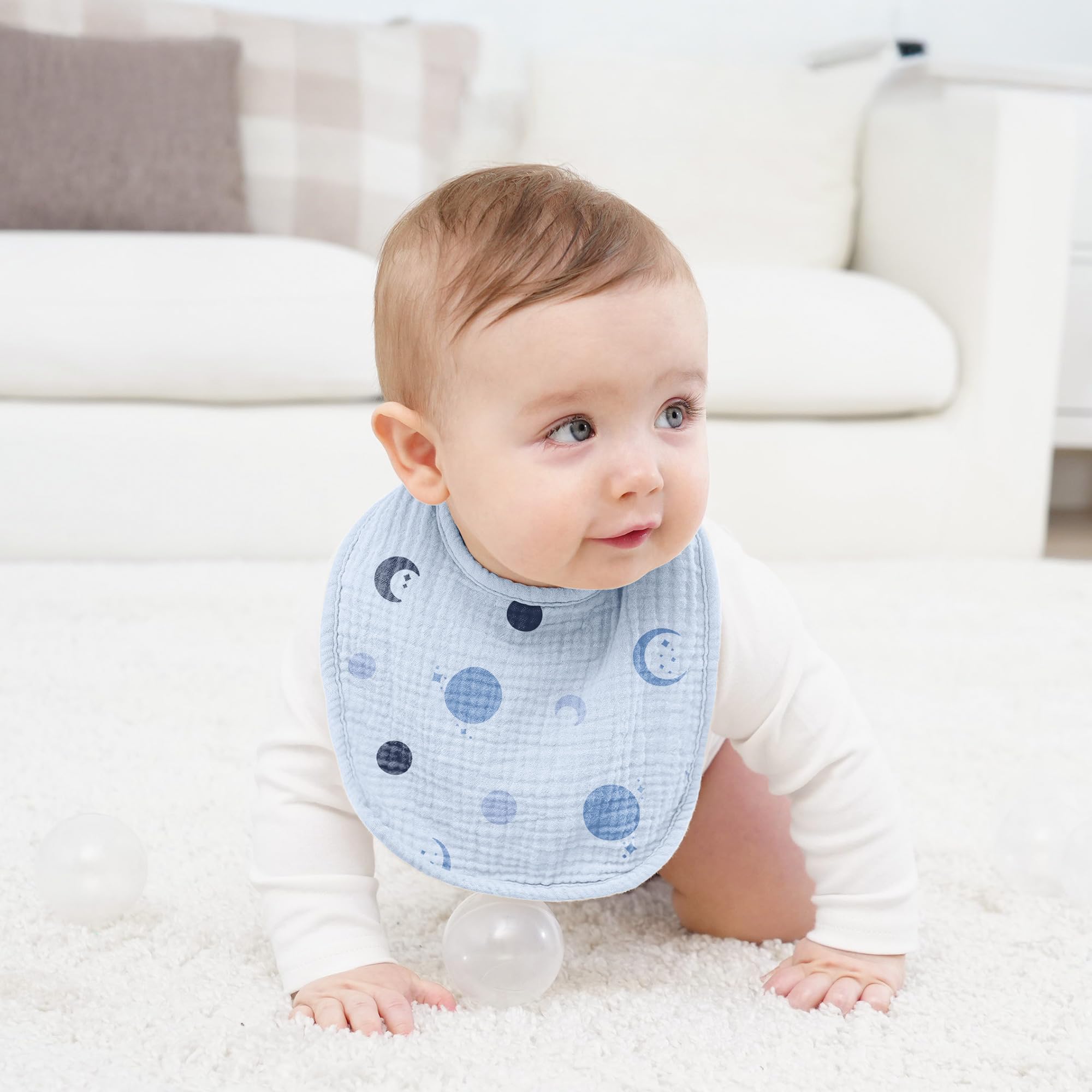 Susurration baby bib adjustable snaps blue stars demonstrates growth-friendly fit on little ones.