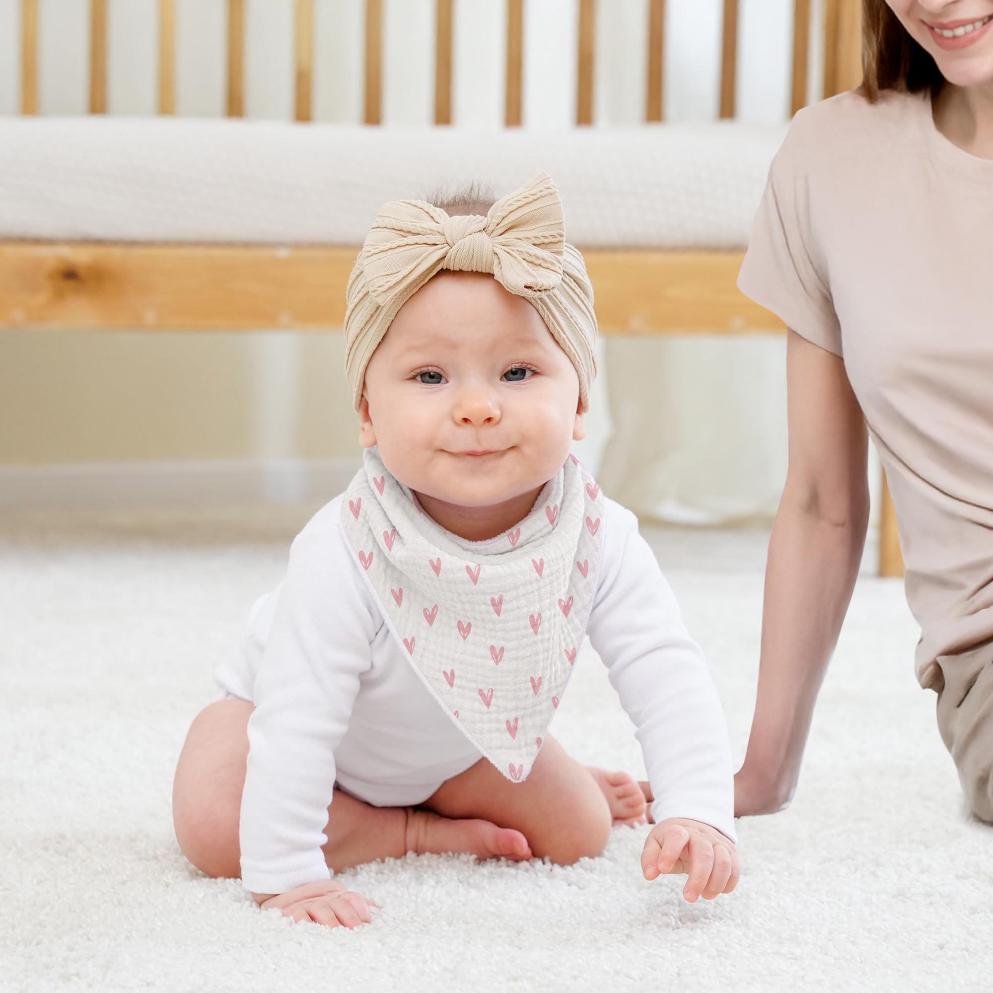 Susurration bandana bib demonstrates drool, feeding, and mess cleanup versatility.