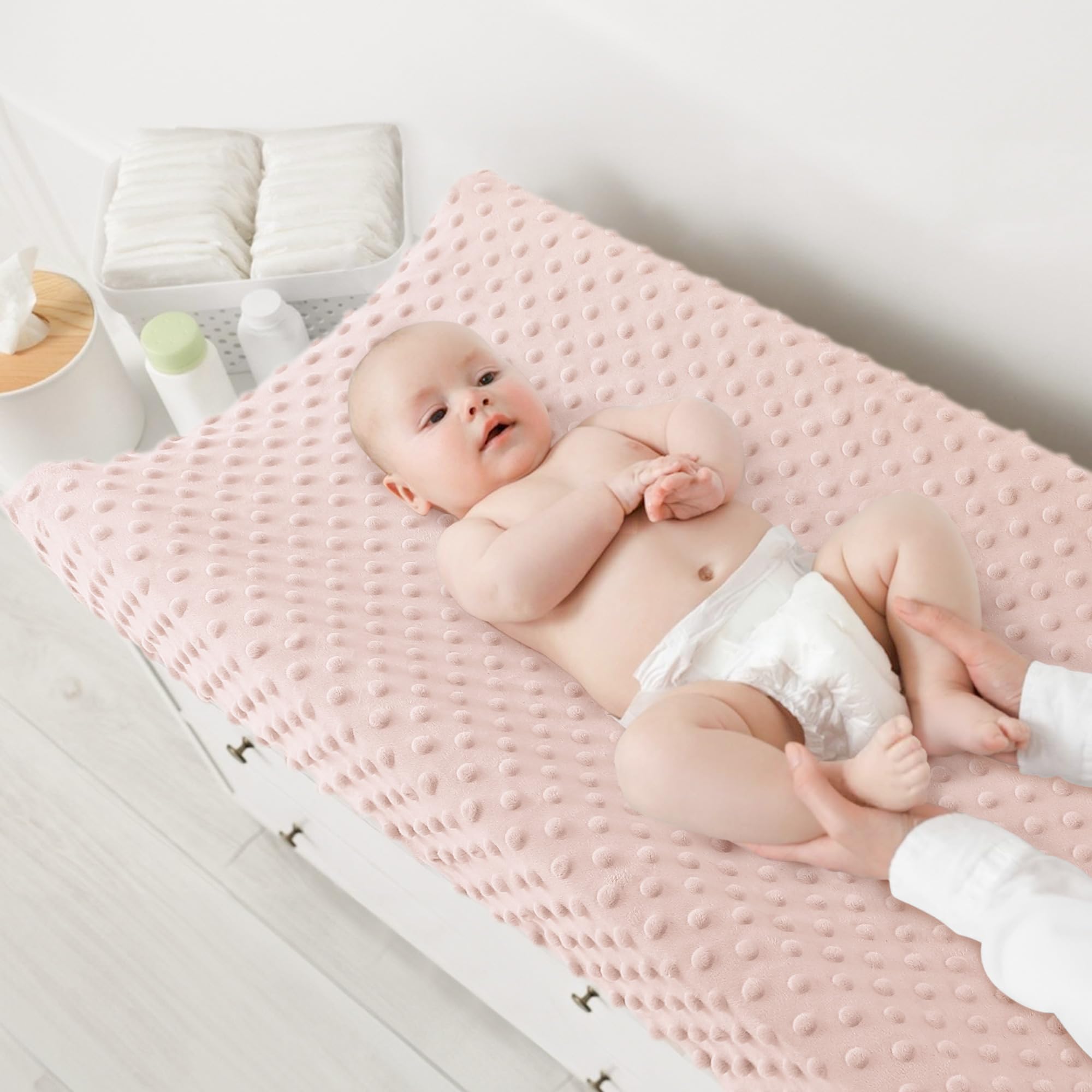 Susurration changing pad cover elastic 360 fit demonstrates secure, slip-free diaper changes.