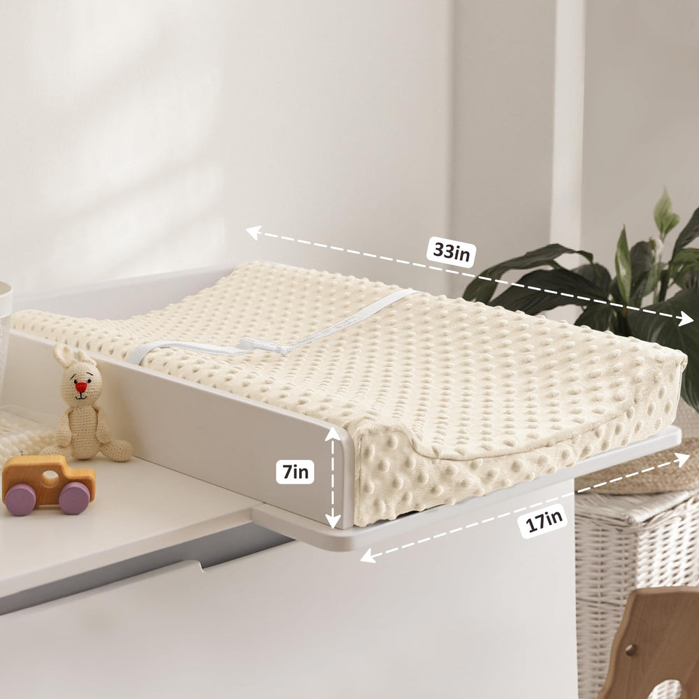 Susurration changing pad cover pink cream fabric detail highlights soft plush minky texture.