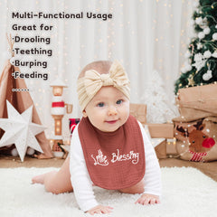 Susurration muslin bibs feature water-resistant plush backing for wet-proof wear.