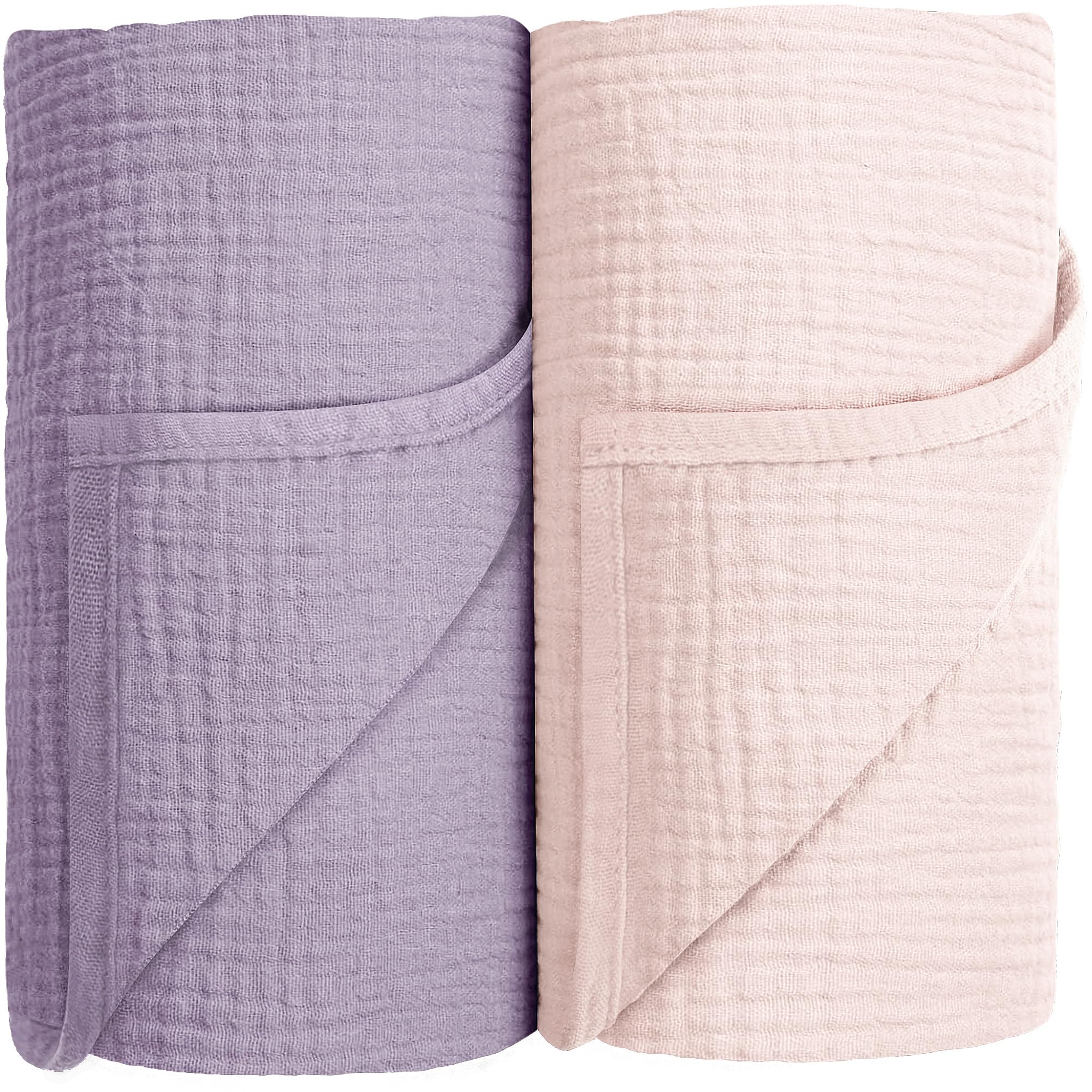 Susurration muslin swaddle blanket pink-purple folded for gentle newborn comfort and breathable wrapping.