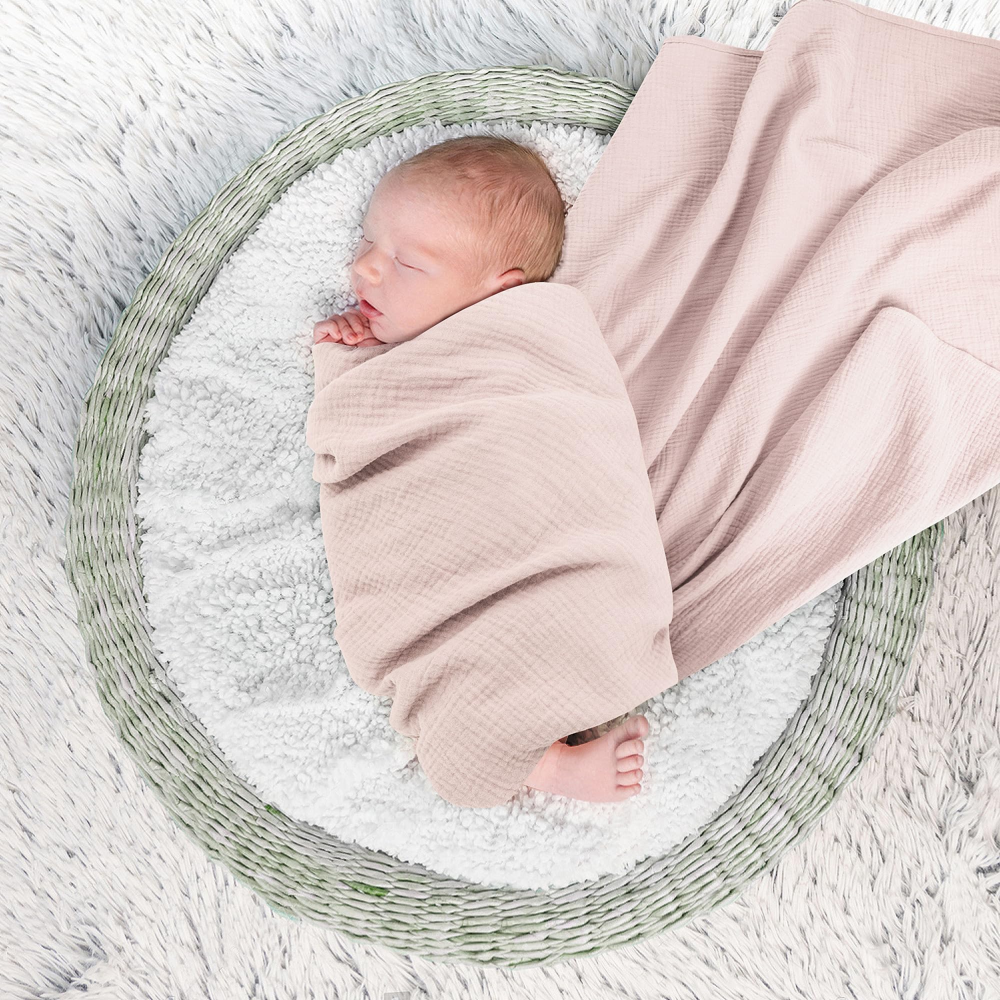 Susurration muslin swaddle blanket pink-purple on-baby shows absorbent and reusable cloth for spills.