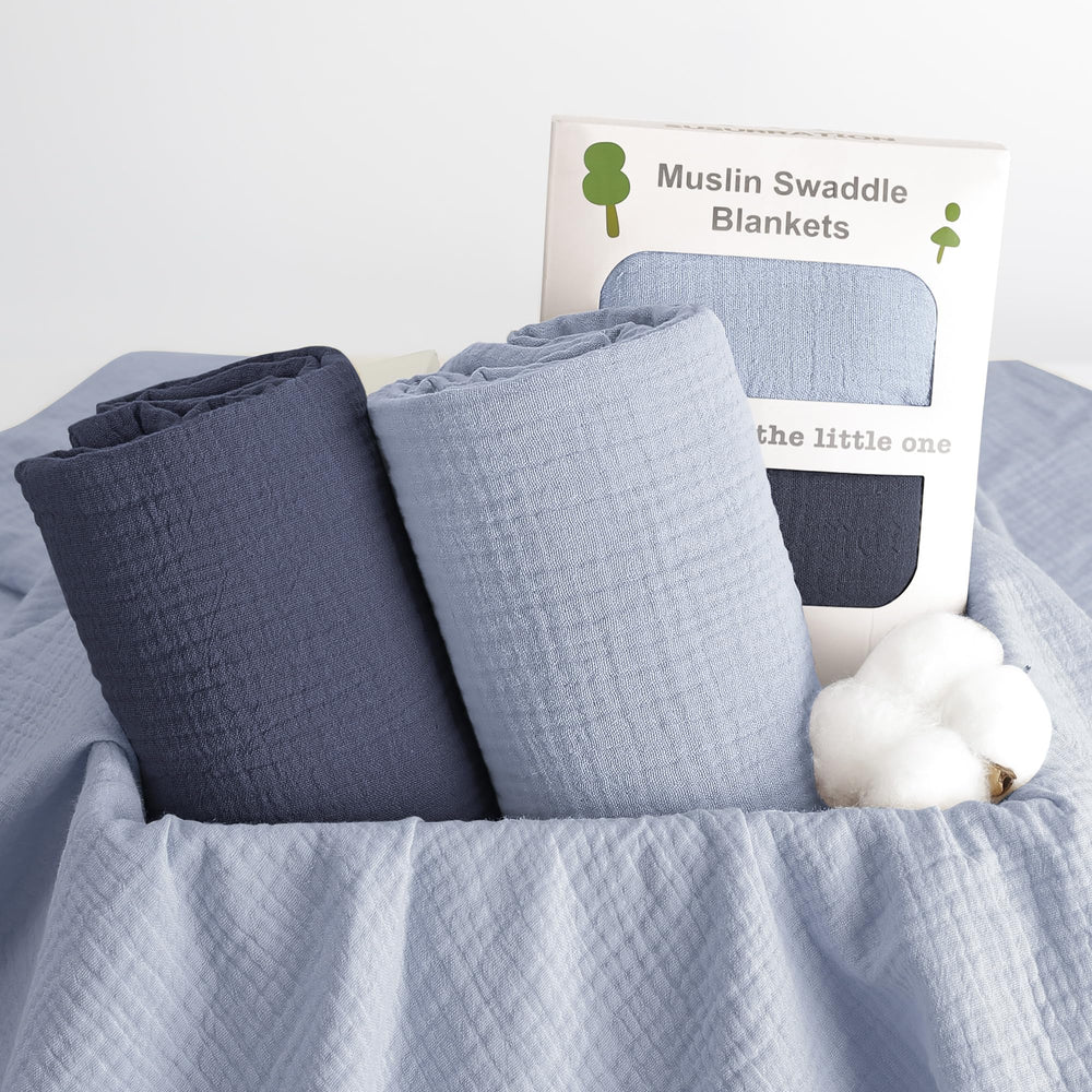 Susurration muslin swaddle navy packaging hints at gift-ready presentation.