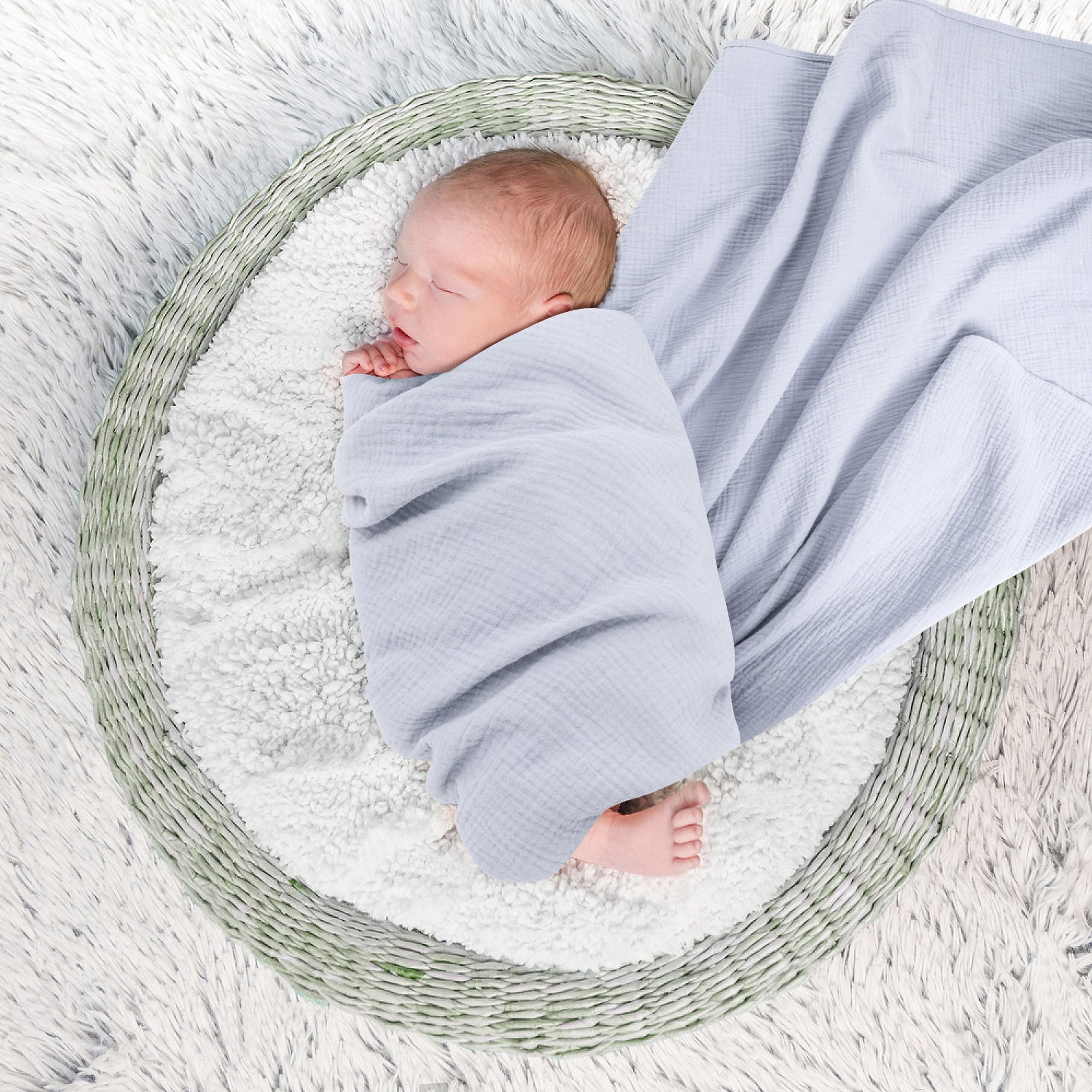 Susurration muslin swaddle blanket navy closeup shows skin-friendly fabric for delicate newborn skin.