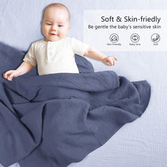 Susurration muslin swaddle navy folded view emphasizes generous 40x40in size for wrapping.