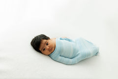 Swaddelini Swaddle Sleep Sack Blue fabric closeup shows recycled nylon texture with breathable comfort.