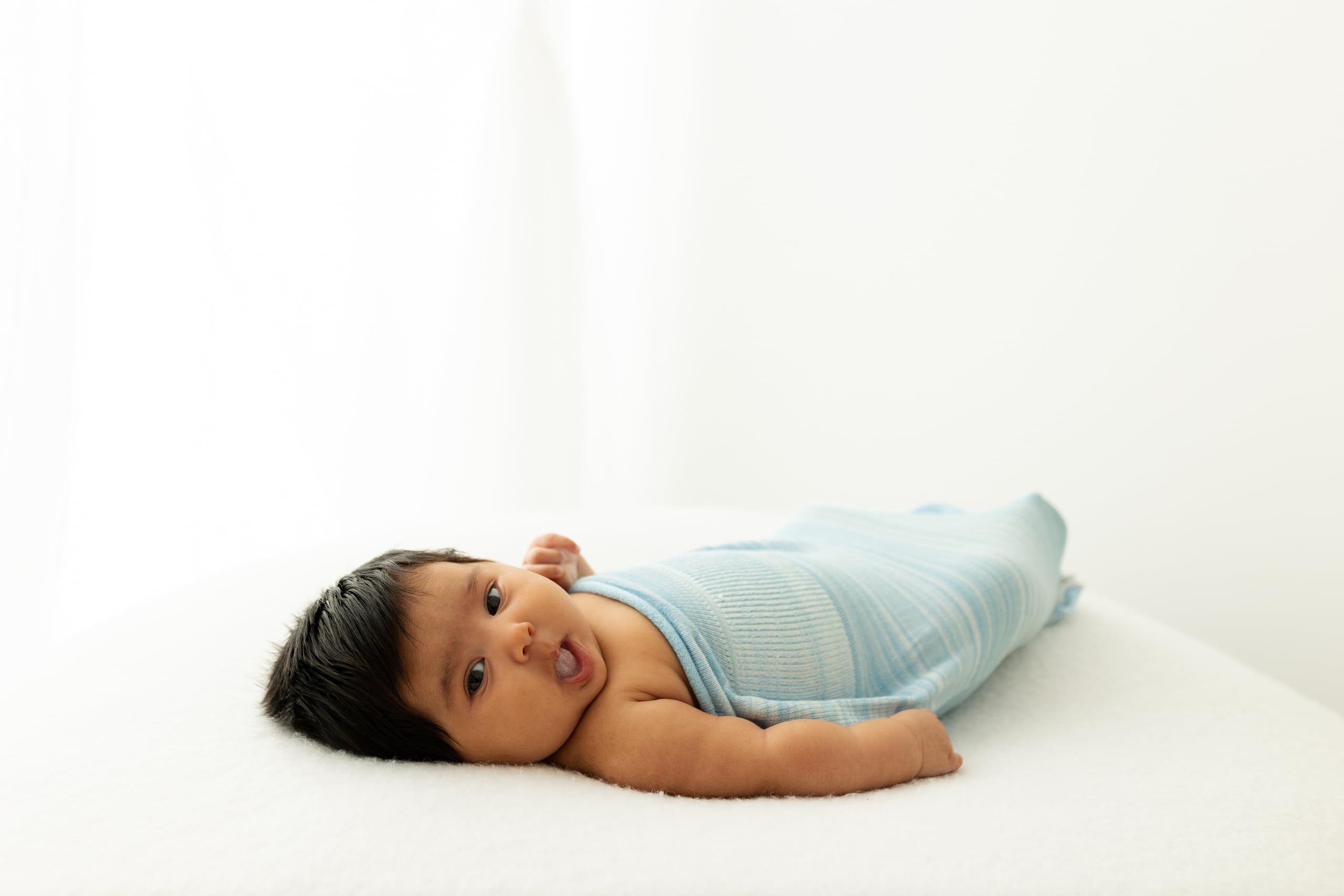 Swaddelini Swaddle Sleep Sack Blue made-in-usa tag emphasizes quality craftsmanship.