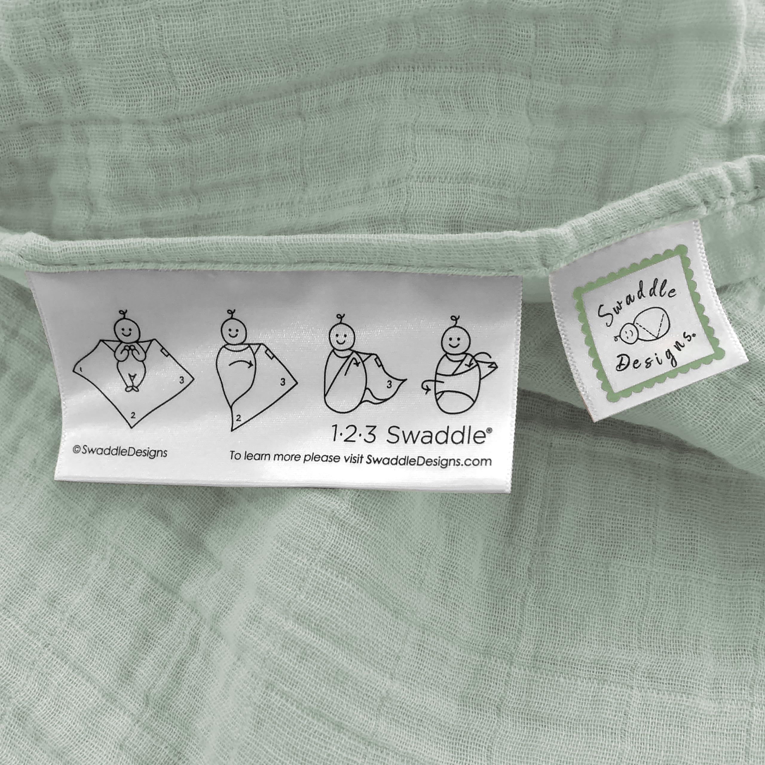 SwaddleDesigns Jadeite baby swaddled for snug comfort