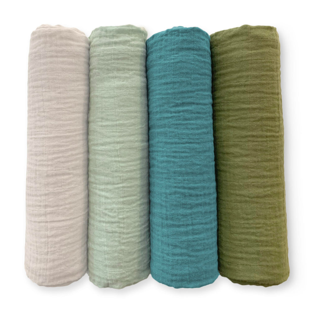 SwaddleDesigns Oceana muslin swaddle blanket folded, showcasing soft texture and versatility.