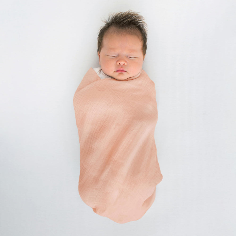 SwaddleDesigns Peach Blush blanket used during tummy time for comfort