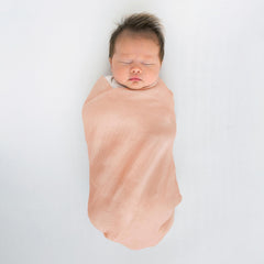 SwaddleDesigns Peach Blush blanket used during tummy time for comfort