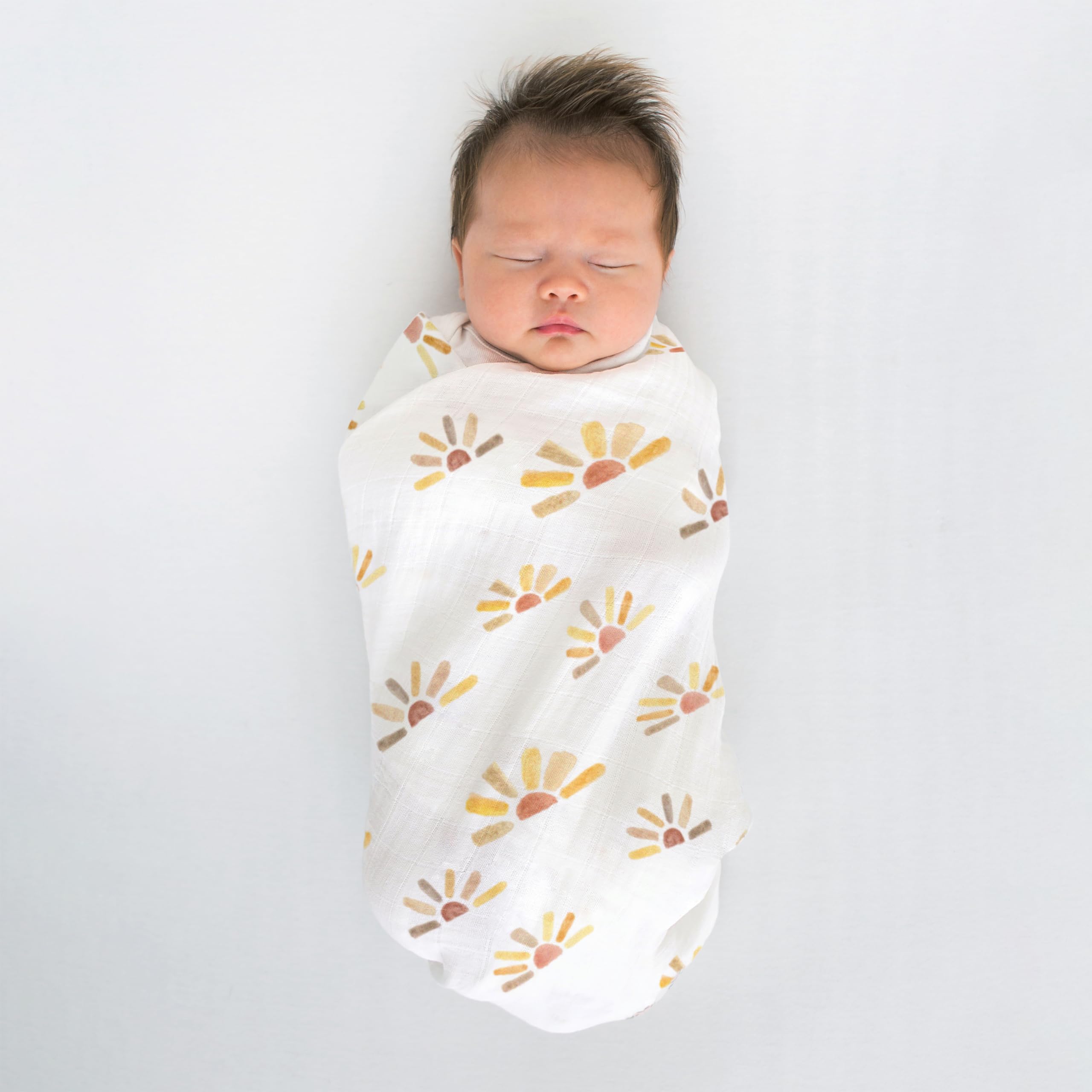 SwaddleDesigns watercolor sunny days edge label shows easy how-to-swaddle instructions