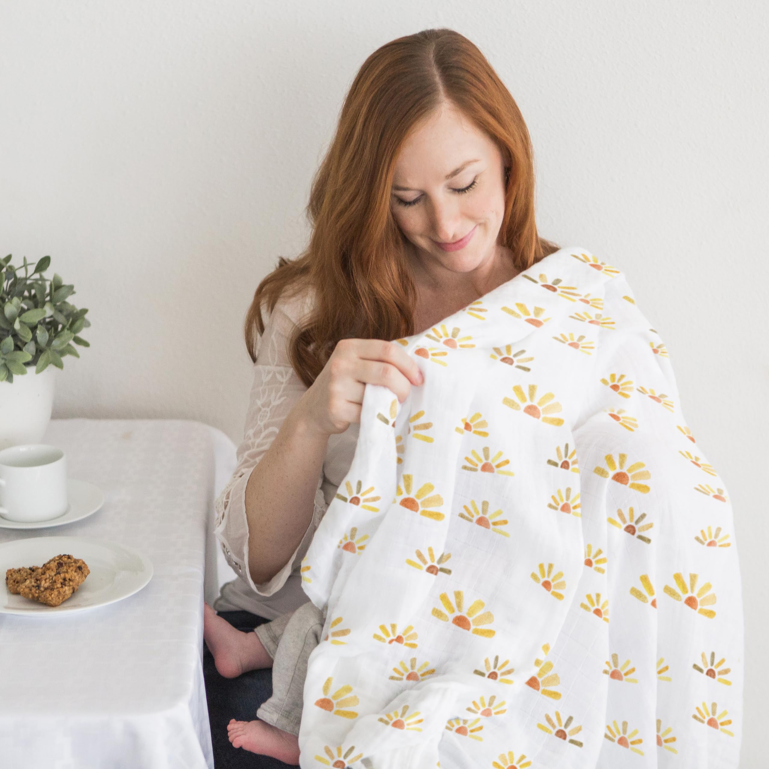 SwaddleDesigns watercolor sunny days stroller use demonstrates sunshield-like coverage