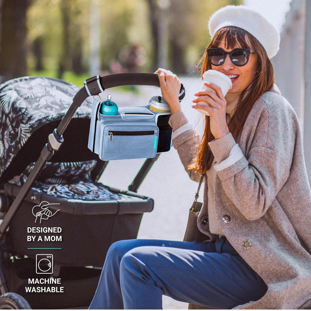 Swanoo stroller caddy wipes pocket stores baby wipes for quick cleanups.